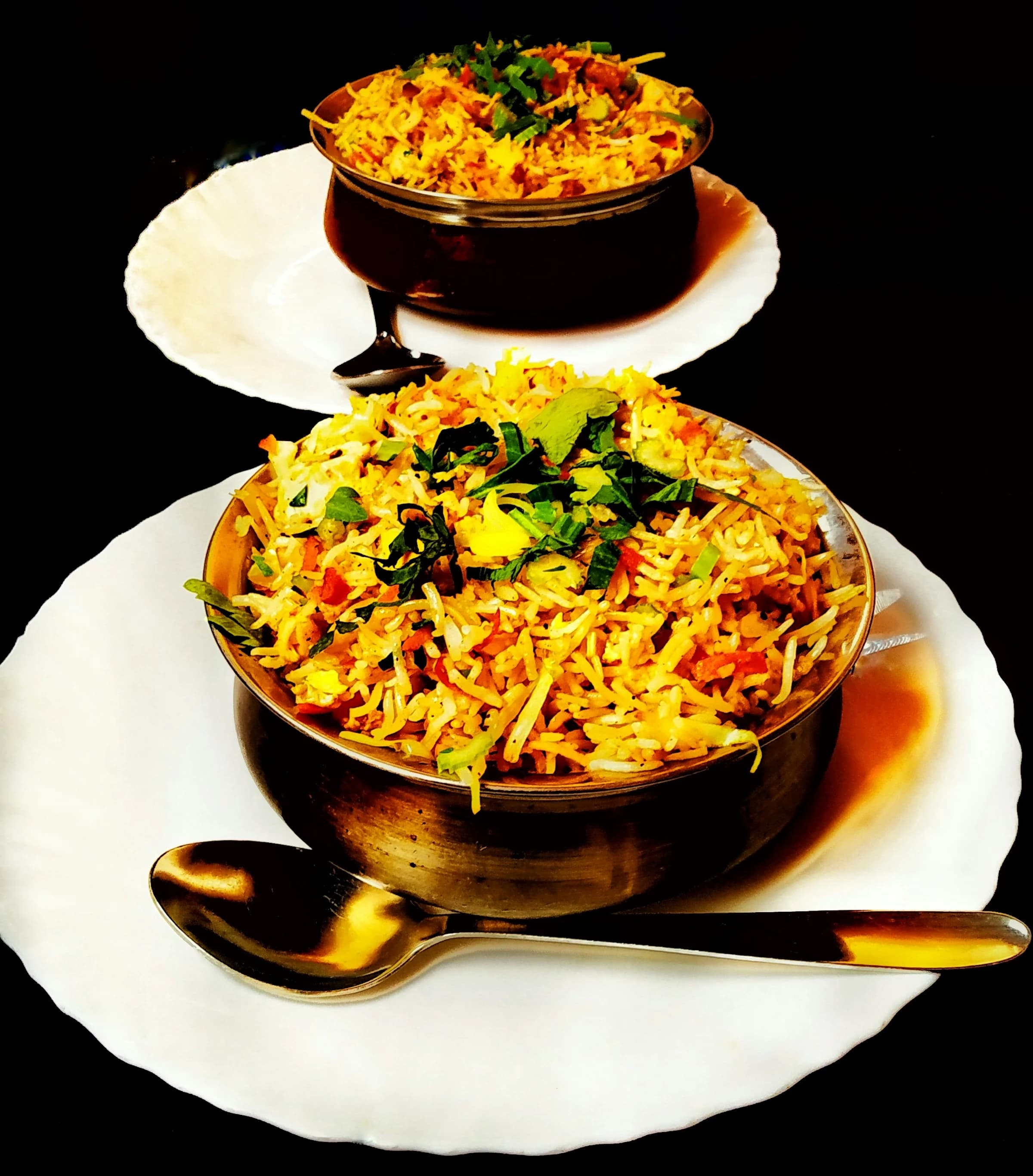 Saffron-infused royal biryani served in copper service