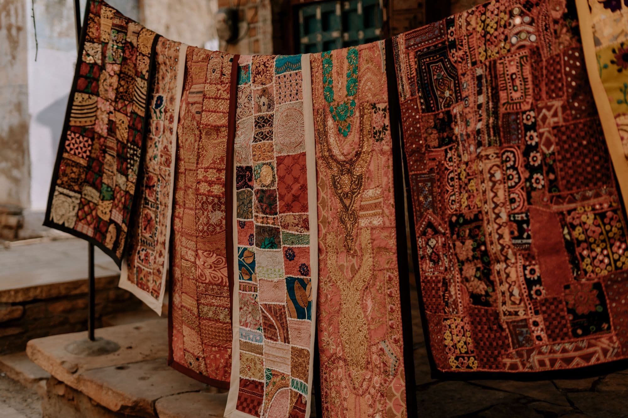 Vibrant embroidered textiles at an Indian craft market