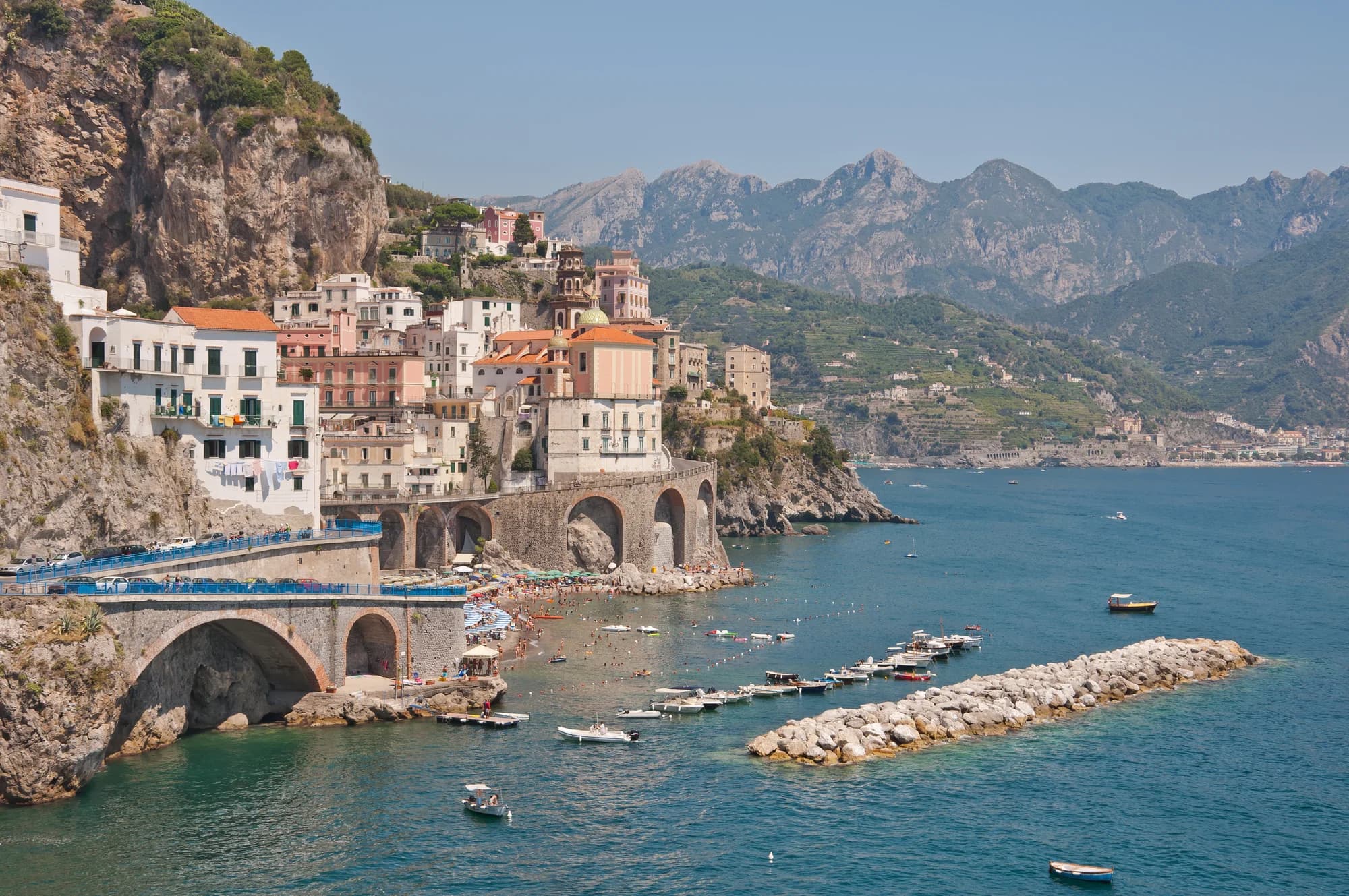 Positano's pastel houses cascading down to the Tyrrhenian Sea at golden hour